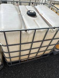 lot 1102 image: Large Plastic IBC Tote with Metal Cage and Pallet Base