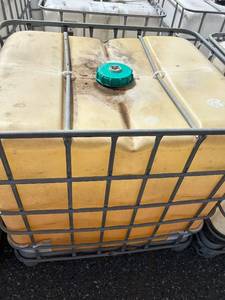 lot 1103 image: Large Plastic IBC Tote Tank with Metal Cage