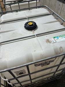 lot 1108 image: Large Plastic IBC Tote with Metal Cage, 275 Gallon Capacity
