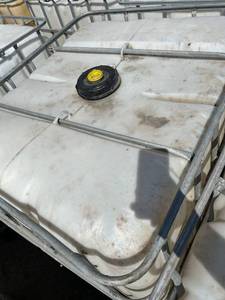 lot 1202 image: Used 275-Gallon IBC Tote with Metal Cage
