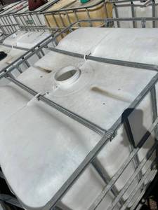 lot 1203 image: Used Plastic IBC Tote with Metal Cage