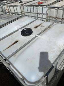 lot 1205 image: Used 275 Gallon IBC Tote with Steel Cage