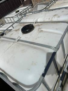 lot 1207 image: Used 275 Gallon IBC Tote Water Storage Tank with Metal Cage