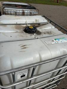 lot 1300 image: Used 275 Gallon IBC Tote Liquid Storage Containers