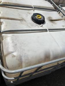 lot 1402 image: Used 275 Gallon IBC Tote Water Storage Container