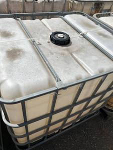 lot 1403 image: Used 275 Gallon IBC Tote with Cage