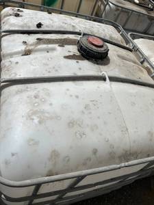 lot 1405 image: Used 275 Gallon IBC Tote with Metal Cage