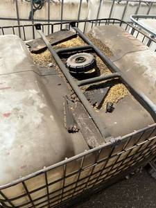 lot 1409 image: Used 275-Gallon IBC Tote with Metal Cage