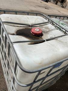 lot 1500 image: Used 275 Gallon IBC Tote Tank with Metal Cage