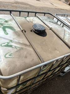 lot 1501 image: Large Plastic Industrial Tote with Metal Cage - Used Oil Storage
