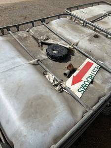 lot 1503 image: Used 275 Gallon IBC Tote Tank with Metal Cage