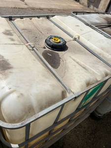 lot 1505 image: Used 275 Gallon IBC Tote Storage Tank with Metal Cage