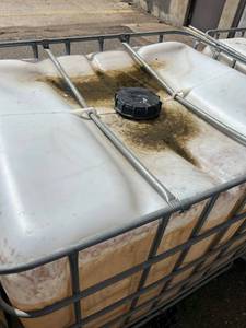 lot 1508 image: Used 275 Gallon IBC Tote with Metal Cage