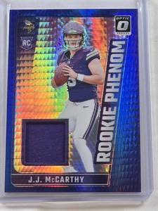 lot 7 image: J.J. McCarthy Rookie 2024 Panini Donruss Optic Blue Hyper Relic #RPB-JMY - Minnesota Vikings Football Card