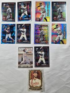 lot 40 image: Lot of 11 Minnesota Twins Baseball Cards Featuring Kirby Puckett, Austin Martin, Carlos Correa, and Byron Buxton