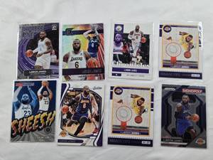 lot 382 image: Lot of 8 LeBron James  Cards featuring Panini Chronicles, NBA Hoops, and Prizm Monopoly themed cards and More