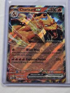 lot 454 image: Charizard EX 2023 Pokemon Card Holo #006165 - Pokemon Trading Card