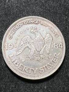 lot 47 image: 1 TROY OZ .999 FINE SILVER 1984 A-MARK LIBERTY ROUND