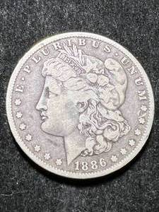 lot 64 image: 1886-O US MORGAN SILVER DOLLAR