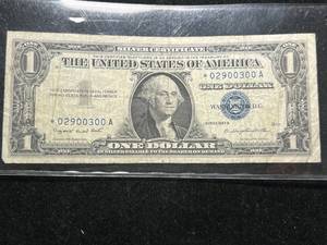 lot 77 image: 1957A US BLUE SEAL $1 SILVER CERTIFICATE STAR NOTE