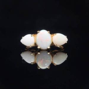 lot 19 image: NEW White Opal Cabochon Pear & Oval Three-Stone Ring in Yellow Gold