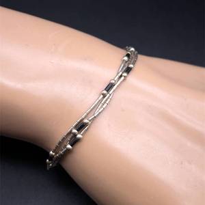 lot 53 image: Liquid Silver Bead & Bar Link Multi-Strand Bracelet