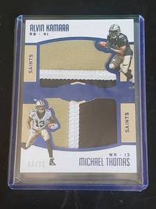 lot 10 image: NFL Saints Card Alvin Kamara and Michael Thomas Player Worn Jersey Sports Card