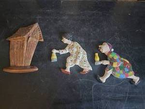 lot 24 image: 1970s Ceramic Wall Plaques Grandma Grandpa rushing to Outhouse Perfect for the Cabin