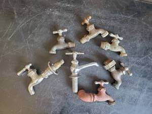 lot 59 image: 7 Brass Water well Spickets of various styles and sizes