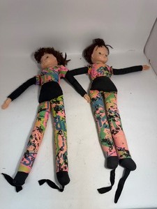 lot 29 image: Lot of (2) Dolls With Feet Straps