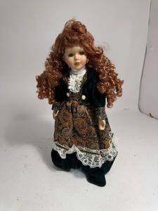 lot 59 image: Porcelain Doll
