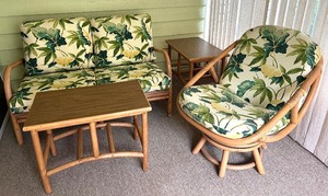lot 85 image: Rattan Patio Furniture Set with Loveseat, Swivel Chair, and 2 End Tables
