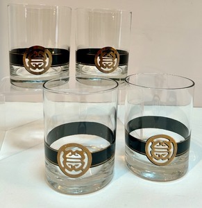 lot 33 image: Set of 4 Vintage Mid Century Style Lowball Glasses with Black and Gold Decorative Band