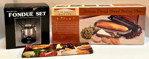 lot 40 image: Stainless Steel Fondue Set, 6-Piece Fondue Fork Set, and Artisan French Bread Baking Pan Bundle