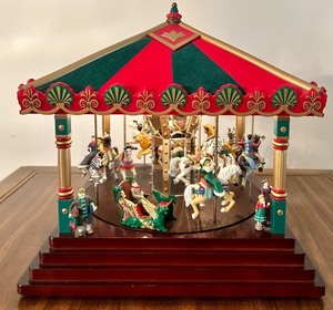 lot 107 image: Holiday Carousel Music Box with Lights and Animal Figures