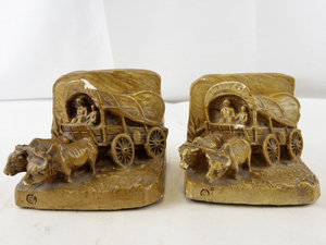 lot 64 image: Pair of Vintage Pioneer Wagon Bookends Ceramic Oxen