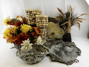 lot 107 image: Home Decor Collection with Woven Baskets, Faux Florals, Metal Mirrors, and Pillow