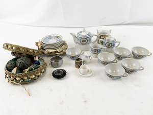 lot 125 image: Vintage Porcelain Childs Tea Set with Plates, Cups, and Wicker Basket