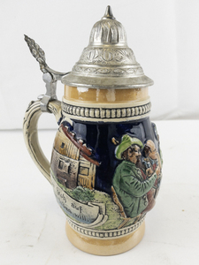 lot 137 image: German Beer Stein with Pewter Lid and Relief Scenes