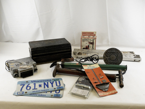 lot 155 image: Automotive and Garage Tool Lot with Tire Chains, License Plates, Pumps, and Accessories