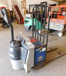 lot 26 image: Nissan 6000lb 24 volt Pallet Jack