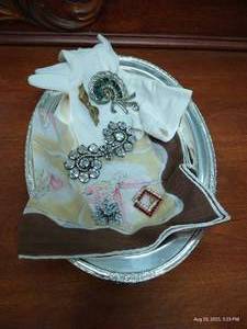lot 231 image: Silver Plate Dish w Handkerchief, Gloves & Brooches