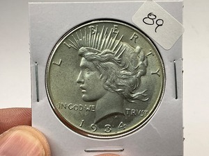 lot 89 image: 1934 Silver Peace Dollar  1 of 24 Coin in Complete Set