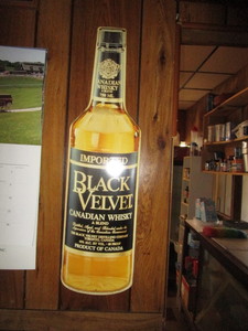 lot 26 image: Black Velvet Tin Sign 8x30
