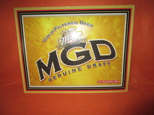 lot 42 image: Miller Genuine Draft Embossed Tin Sign 28x36