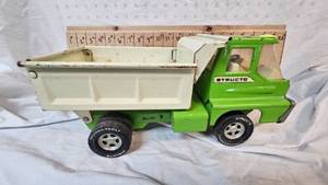 lot 12 image: Structo Pressed Steel Dump Truck wThunderbolt Tires, mid 20th Century