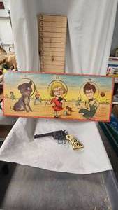 lot 66 image: Buster Brown Target Game and Cowhand Cap Gun