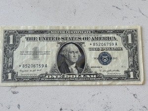 lot 76 image: 1957 A Blue Seal $1 Dollar Silver Certificate Star Note