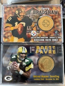 lot 130 image: Bradshaw and Favre Medallions