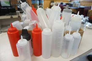 lot 69 image: Box Full of Clear Plastic Squeeze Bottles (10oz and larger)